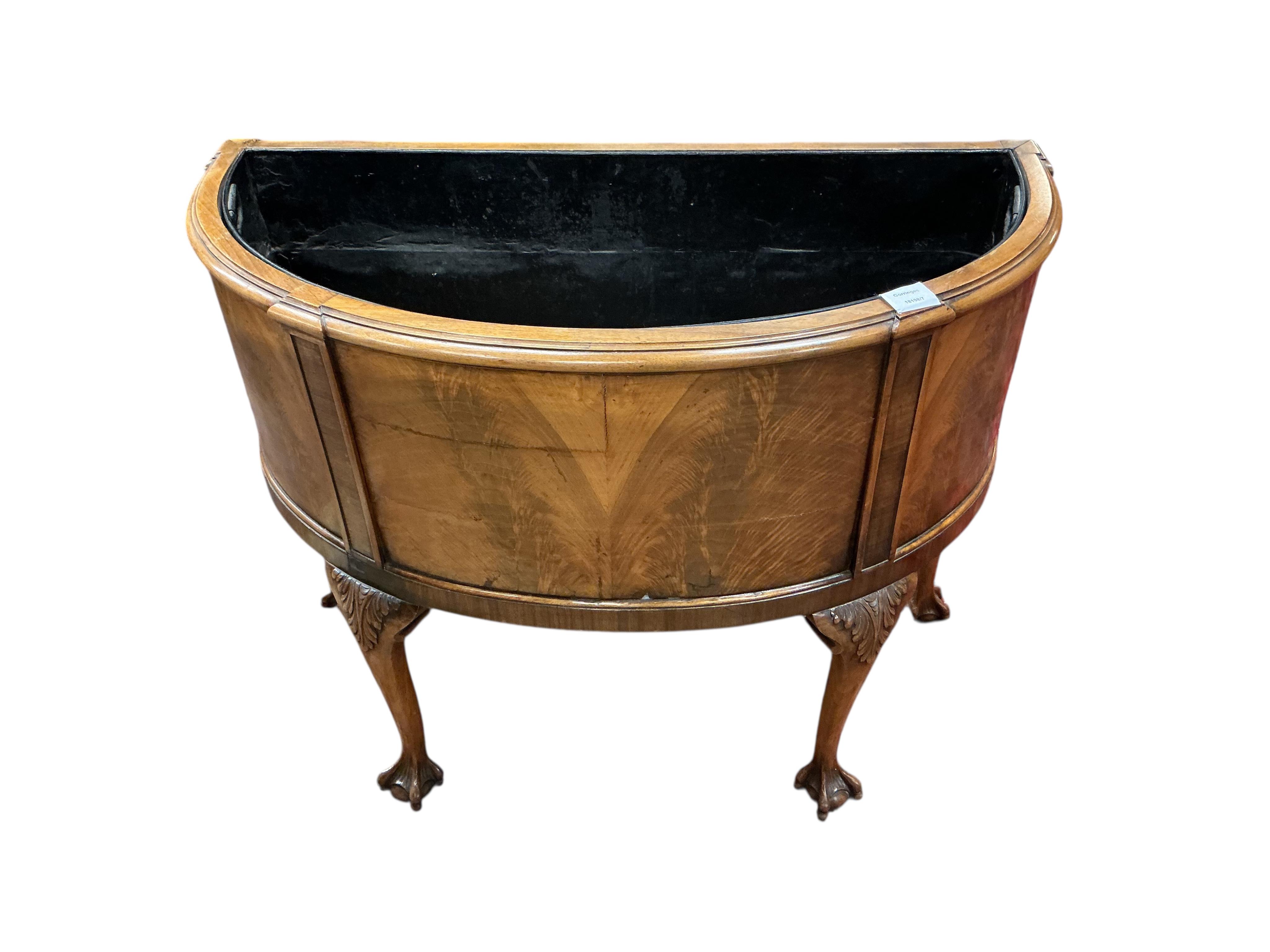 A Queen Anne Revival walnut bowfront jardiniere, width 86cm, depth 40cm, height 69cm